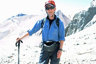 05 Jerome Ryan Put On His Helmet In A Rockfall Area In Warm 15C Weather On The Climb From Plaza Argentina Base Camp To Camp 1